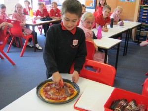 Preparing to share the home made pizza
